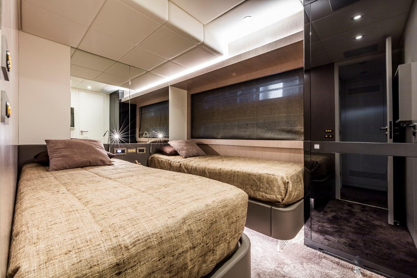 a bedroom with a bed and a desk aboard NEW OCEANIC 76/81 GT Yacht for Sale