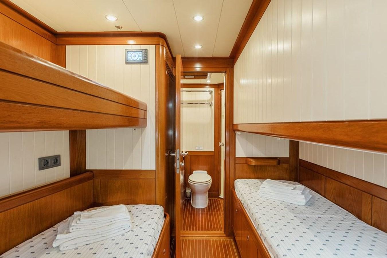a room with a bed and a desk aboard PAULINE AF SKANOR Yacht for Sale