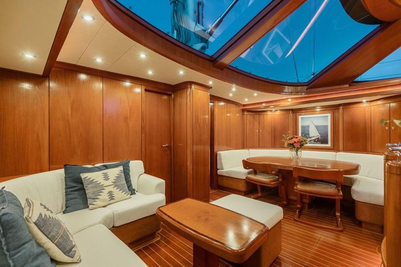 a room with a couch and a table aboard PAULINE AF SKANOR Yacht for Sale