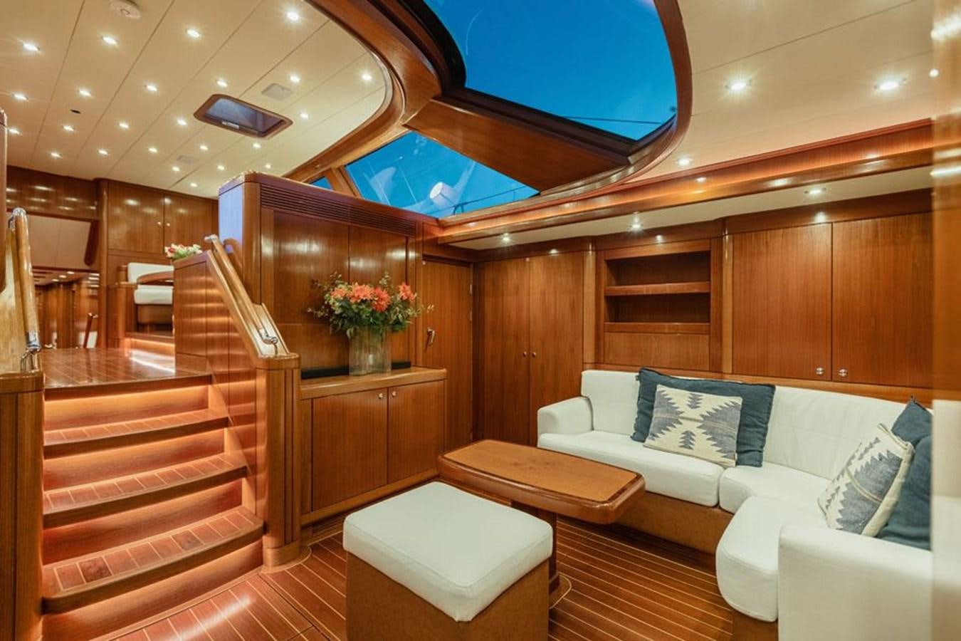 a room with a couch and a table aboard PAULINE AF SKANOR Yacht for Sale