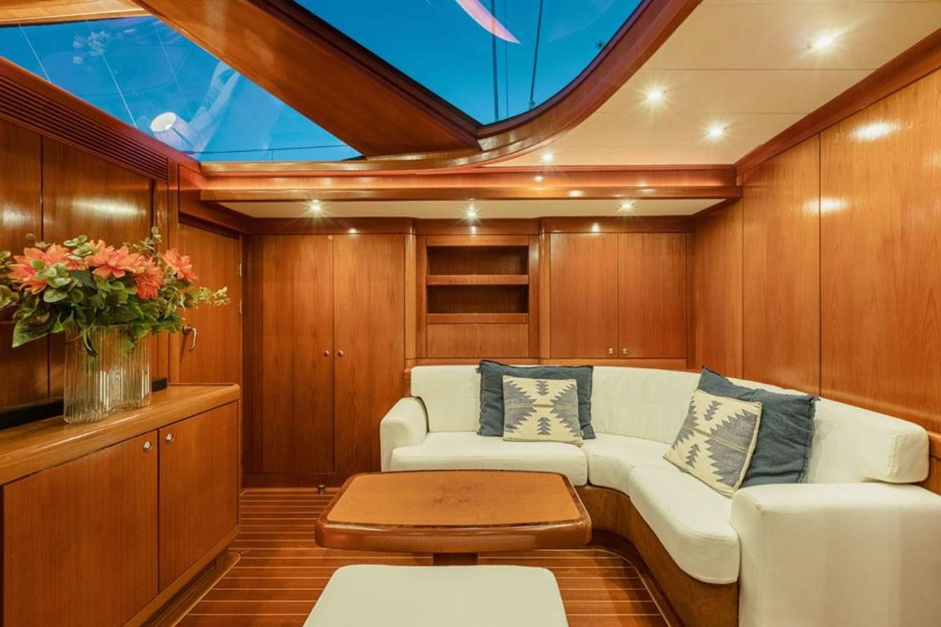 a room with a couch and a table aboard PAULINE AF SKANOR Yacht for Sale