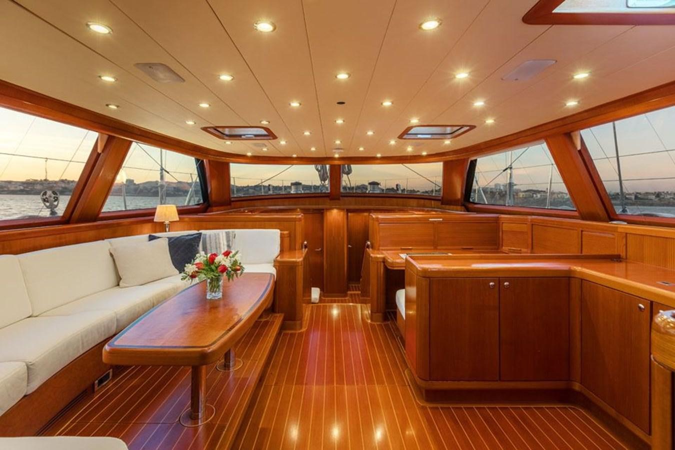 a room with a table and chairs aboard PAULINE AF SKANOR Yacht for Sale