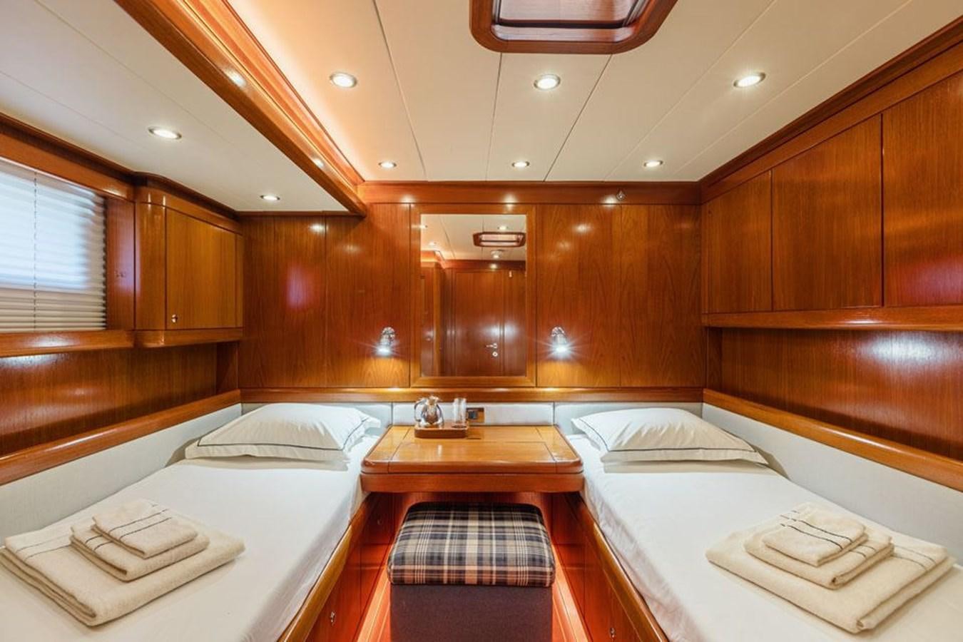a bathroom with wooden cabinets aboard PAULINE AF SKANOR Yacht for Sale