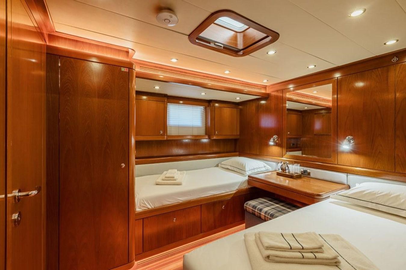a room with a bed and a cupboard aboard PAULINE AF SKANOR Yacht for Sale