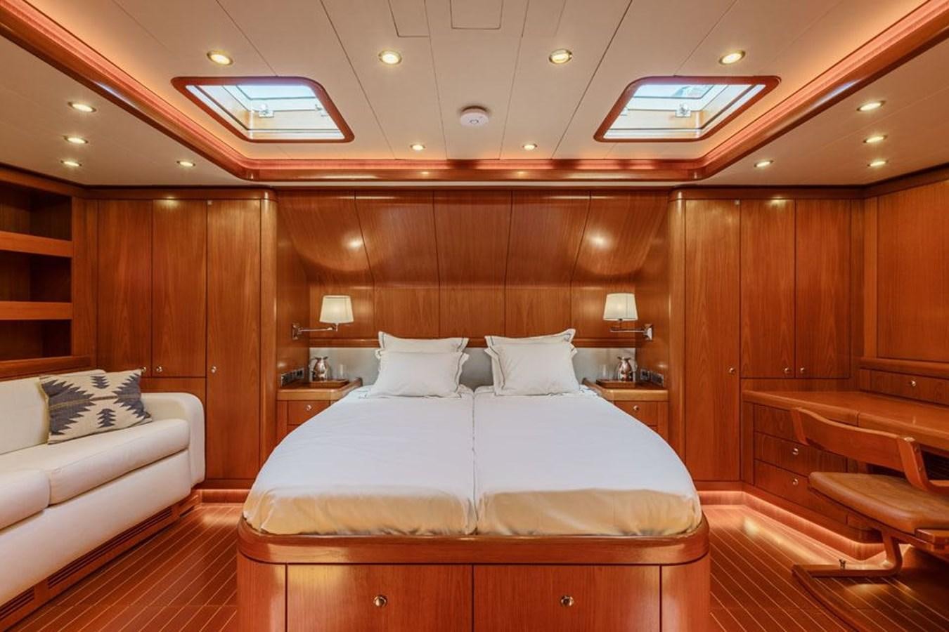 a room with a bed and a couch aboard PAULINE AF SKANOR Yacht for Sale