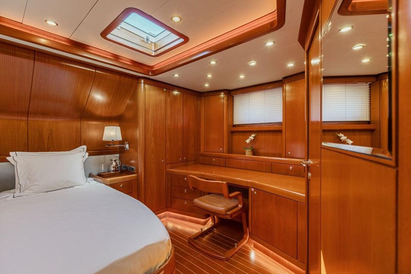 a room with a bed and a desk aboard PAULINE AF SKANOR Yacht for Sale