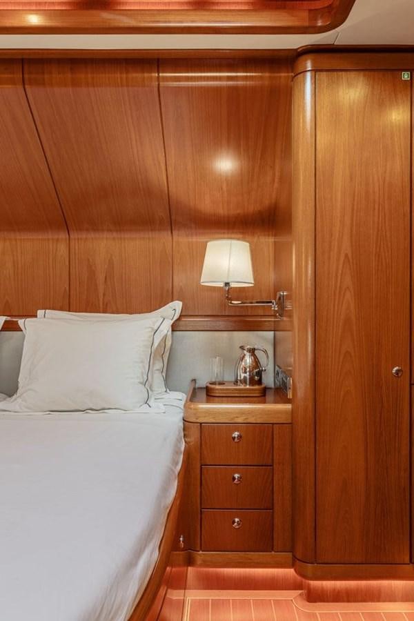 a bed with a white bed aboard PAULINE AF SKANOR Yacht for Sale
