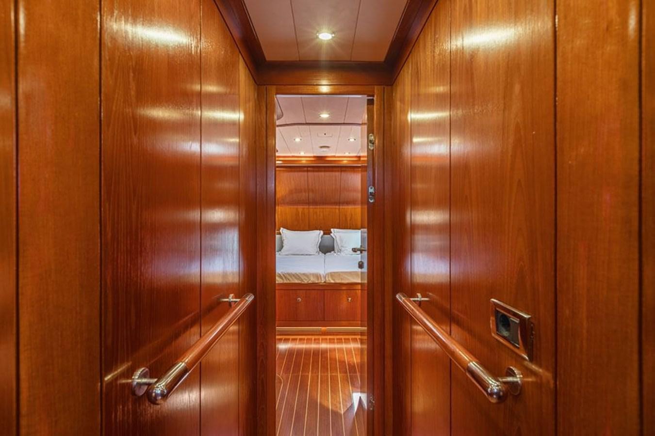 a bathroom with wooden cabinets aboard PAULINE AF SKANOR Yacht for Sale
