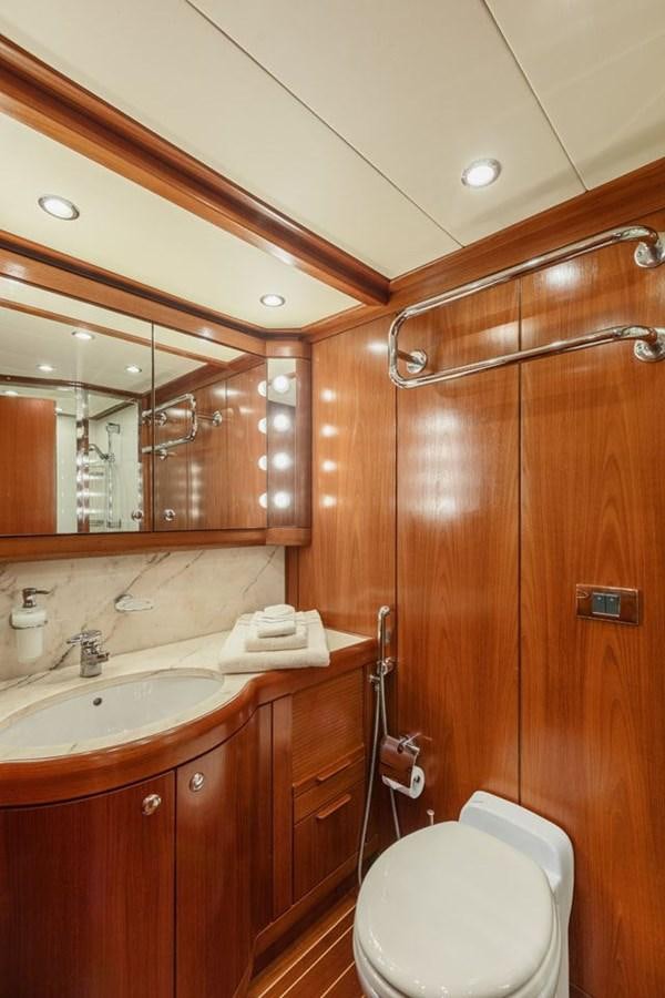 a bathroom with a toilet and a sink aboard PAULINE AF SKANOR Yacht for Sale