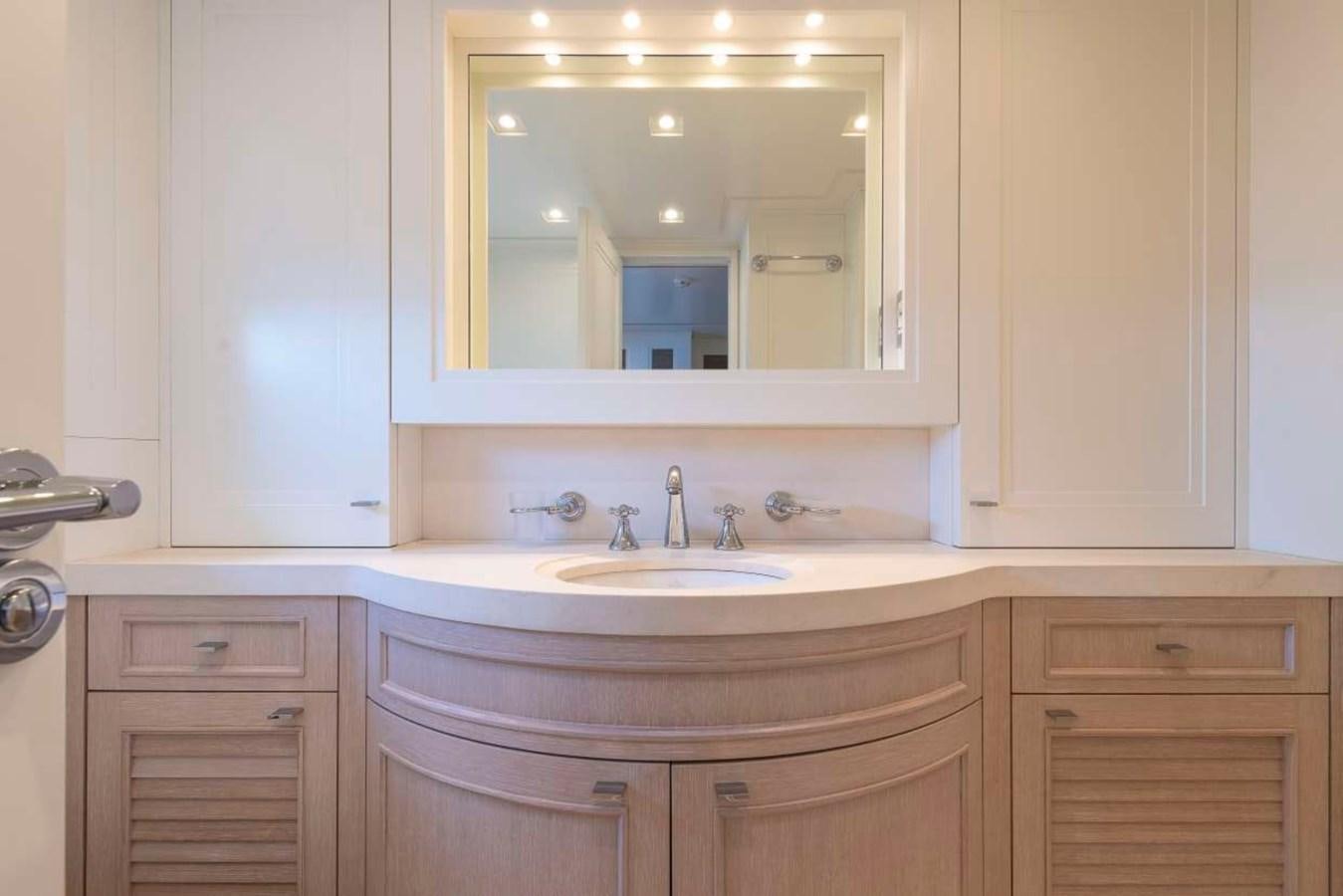 a bathroom with a large mirror aboard CHRISTINA Yacht for Sale