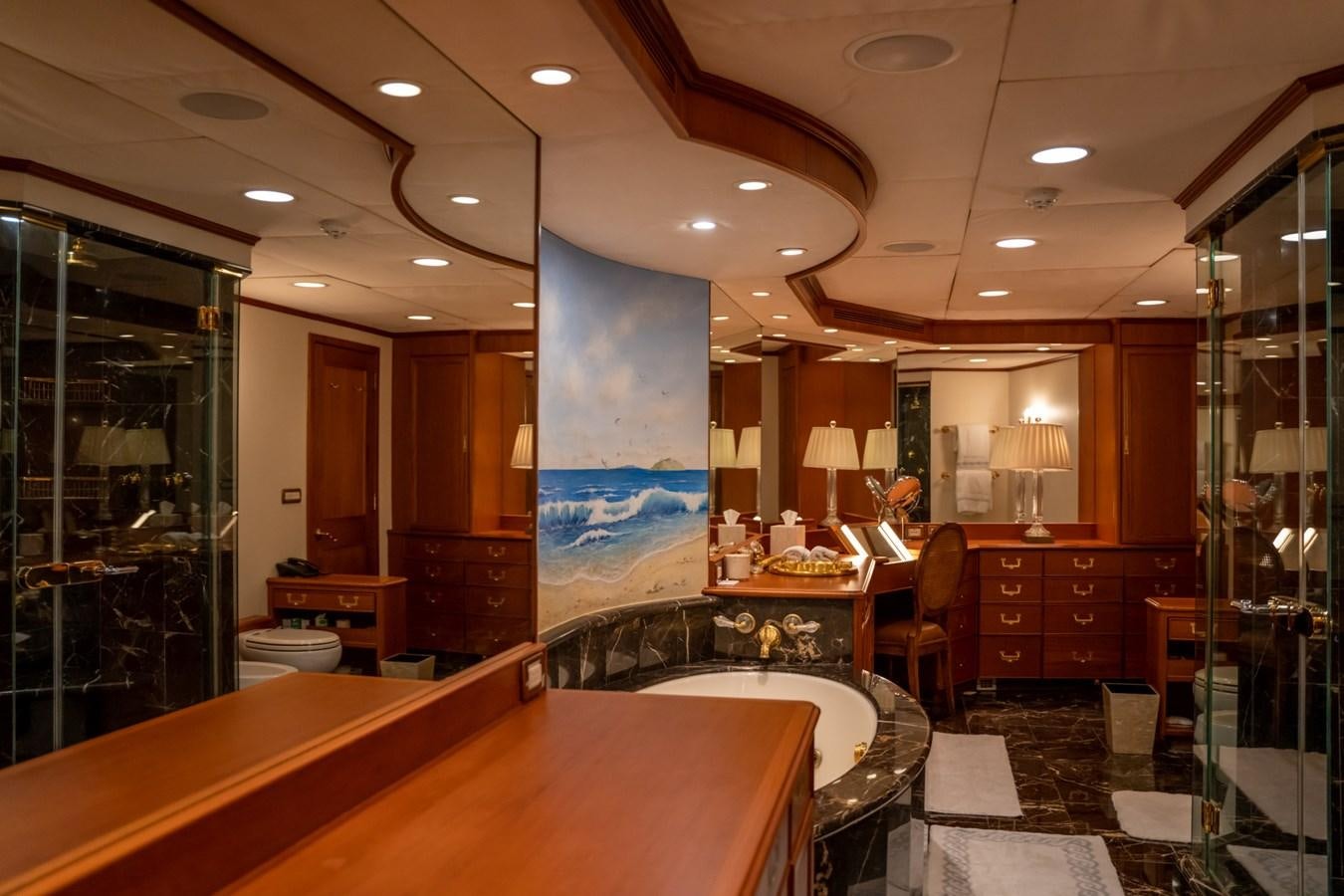 a large kitchen with a counter and chairs aboard SEA FALCON II Yacht for Sale