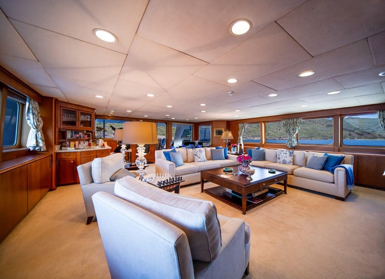 a living room with a large window aboard SEA FALCON II Yacht for Sale