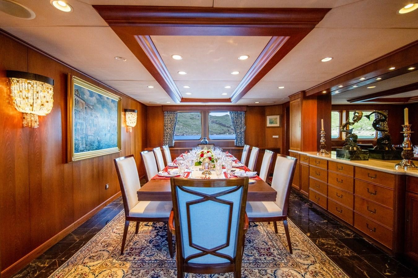a dining room with a table and chairs aboard SEA FALCON II Yacht for Sale