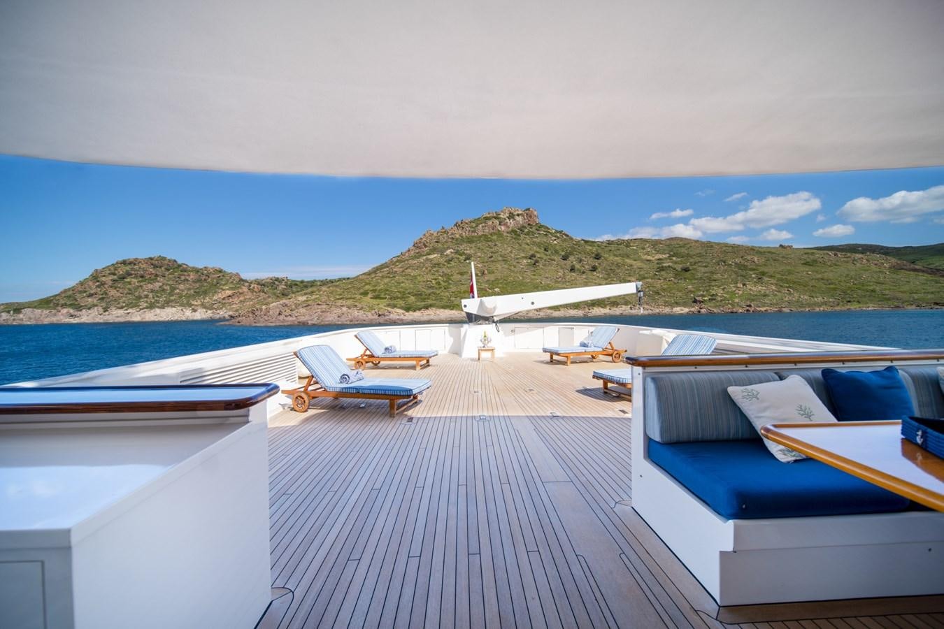 a deck with boats on it and a plane in the background aboard SEA FALCON II Yacht for Sale
