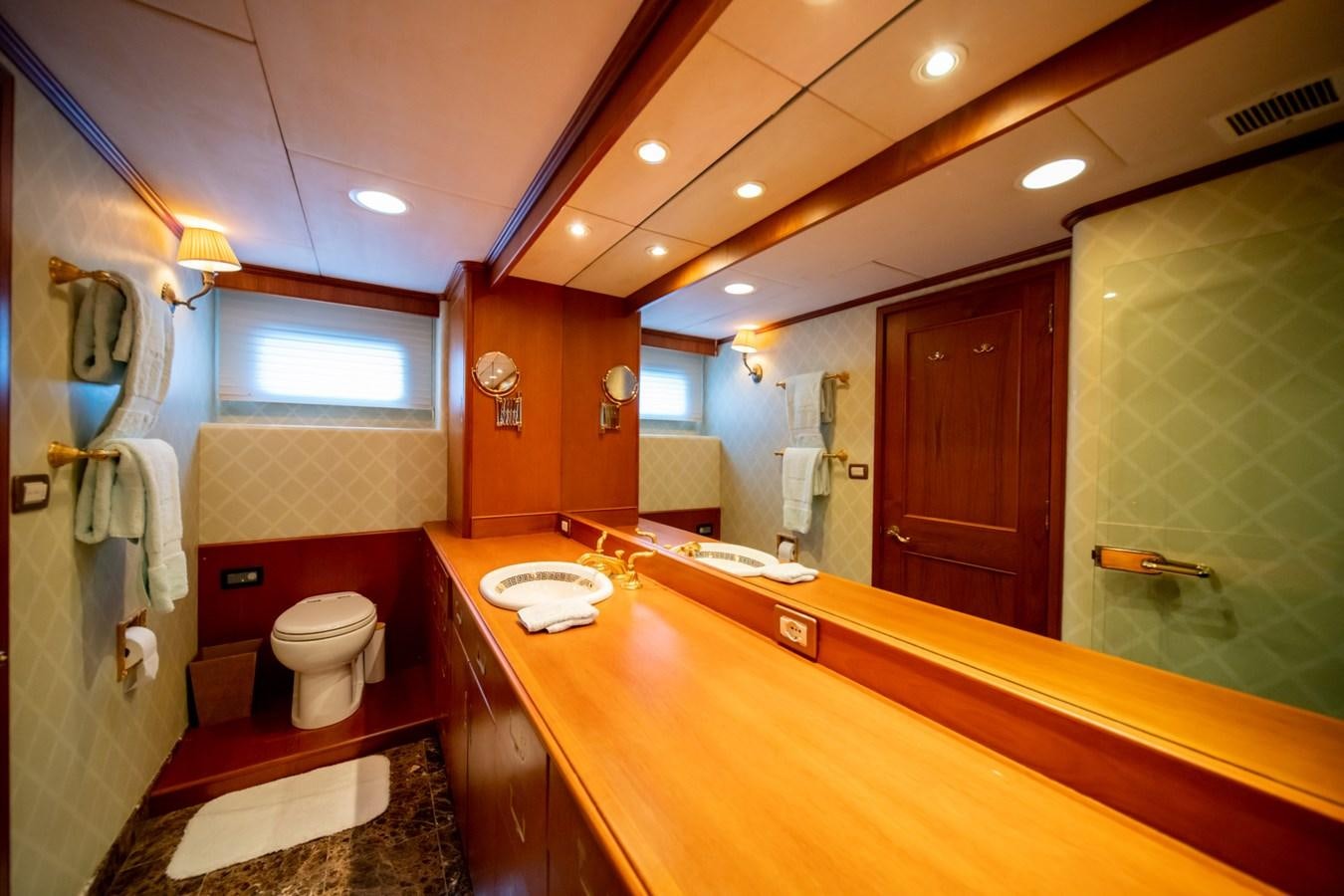 a bathroom with a large mirror aboard SEA FALCON II Yacht for Sale