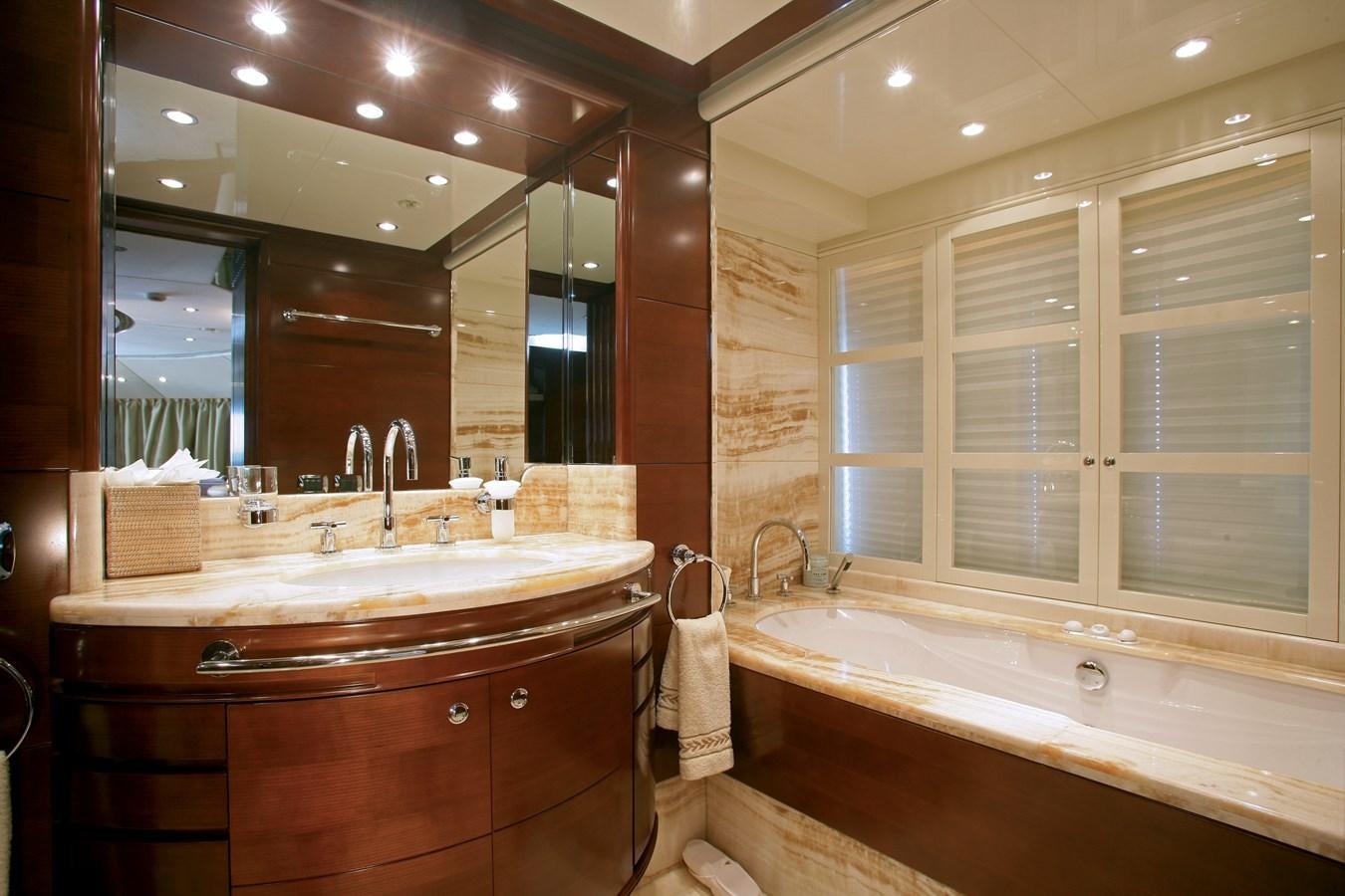 a bathroom with a large mirror aboard SEASCAPE V Yacht for Sale