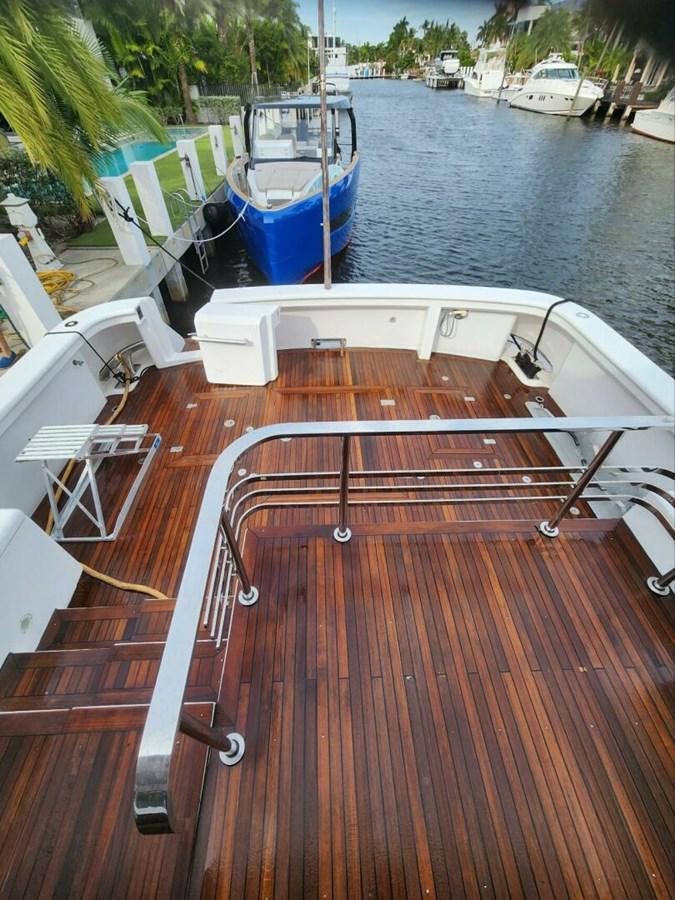 a deck with a boat and a dock aboard MARGAUX Yacht for Sale