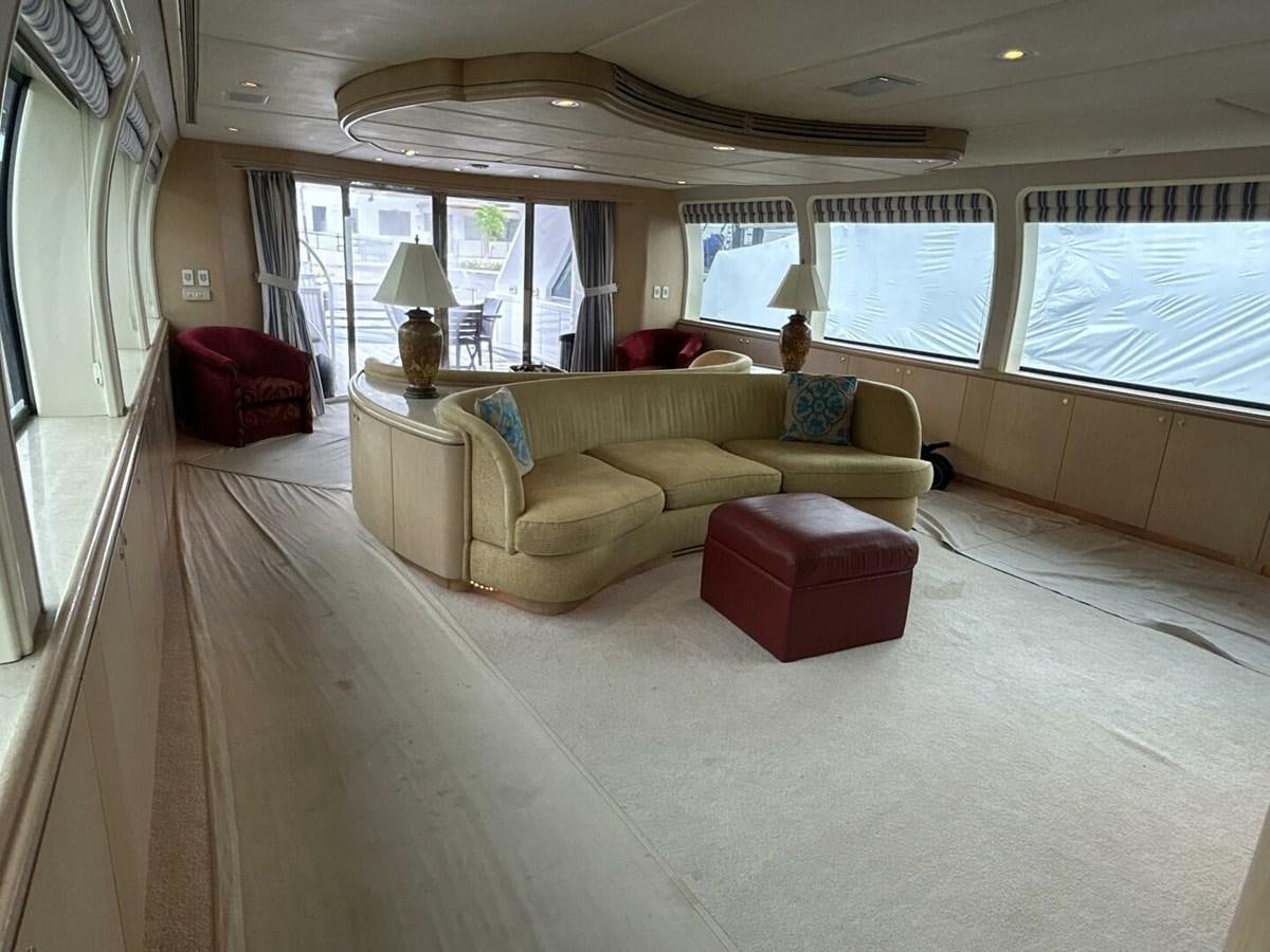 a living room with a couch and a window aboard MARGAUX Yacht for Sale