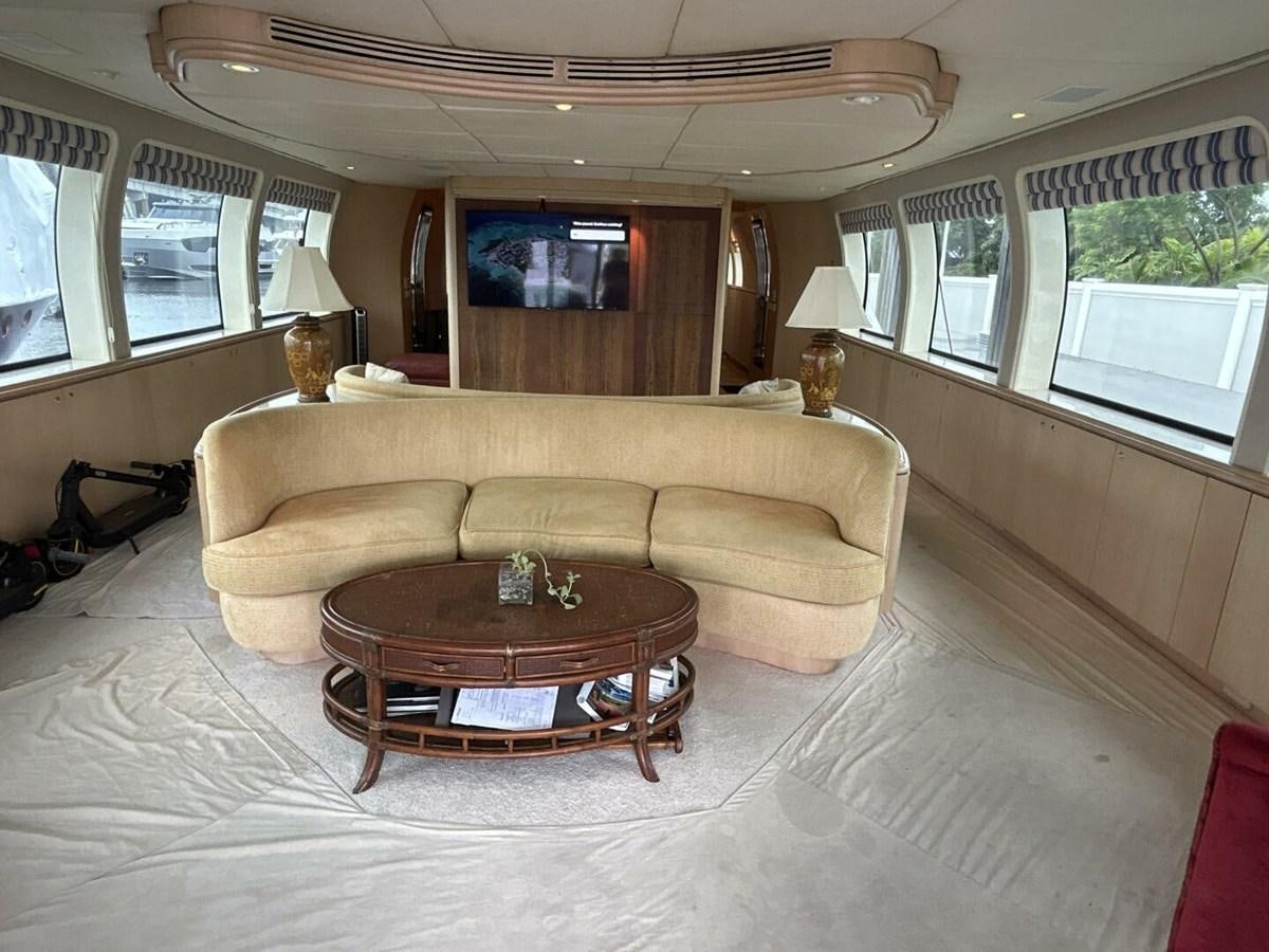 a living room with a couch and a coffee table aboard MARGAUX Yacht for Sale