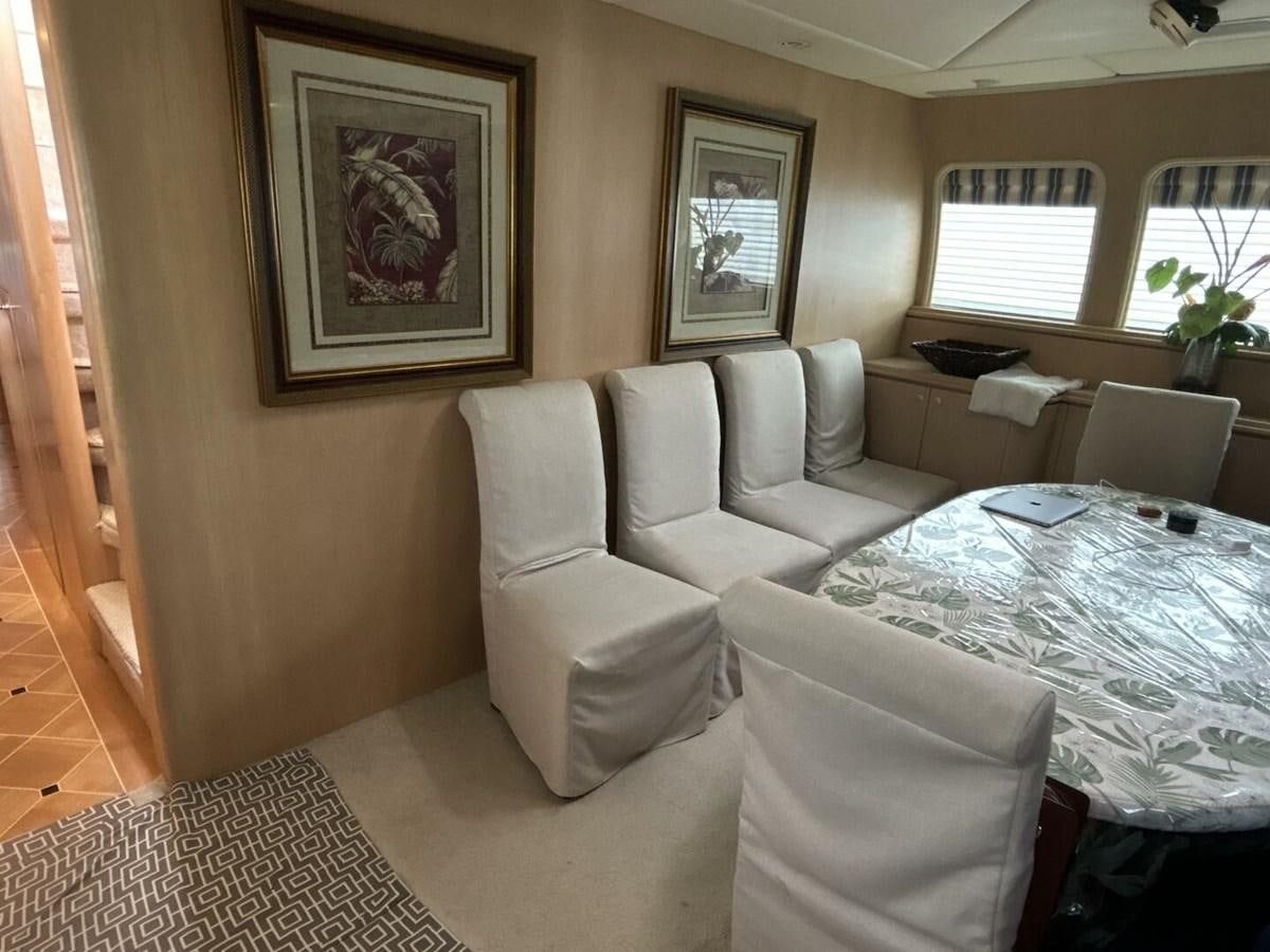 a room with a bed and a chair aboard MARGAUX Yacht for Sale