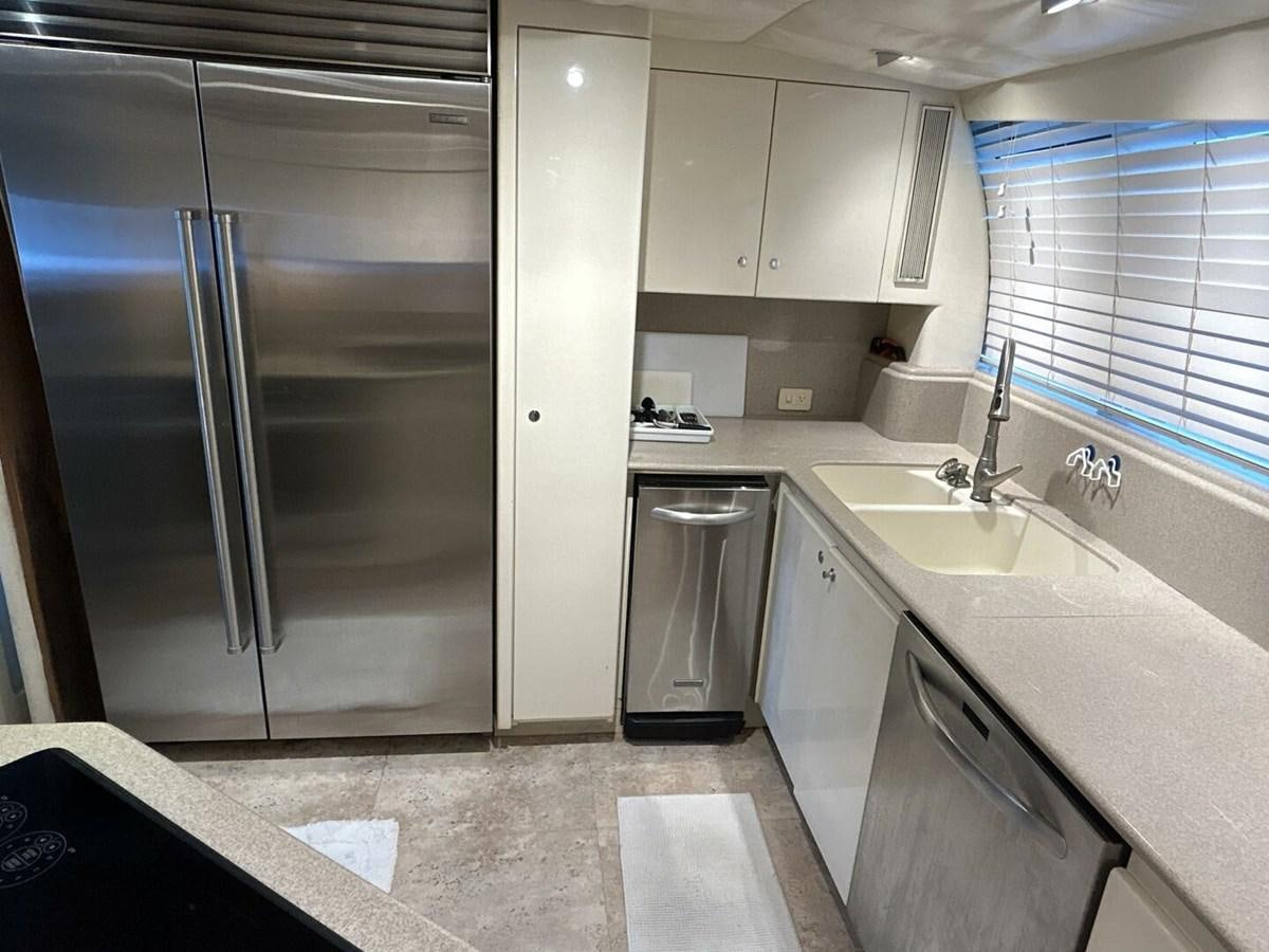 a kitchen with stainless steel appliances aboard MARGAUX Yacht for Sale