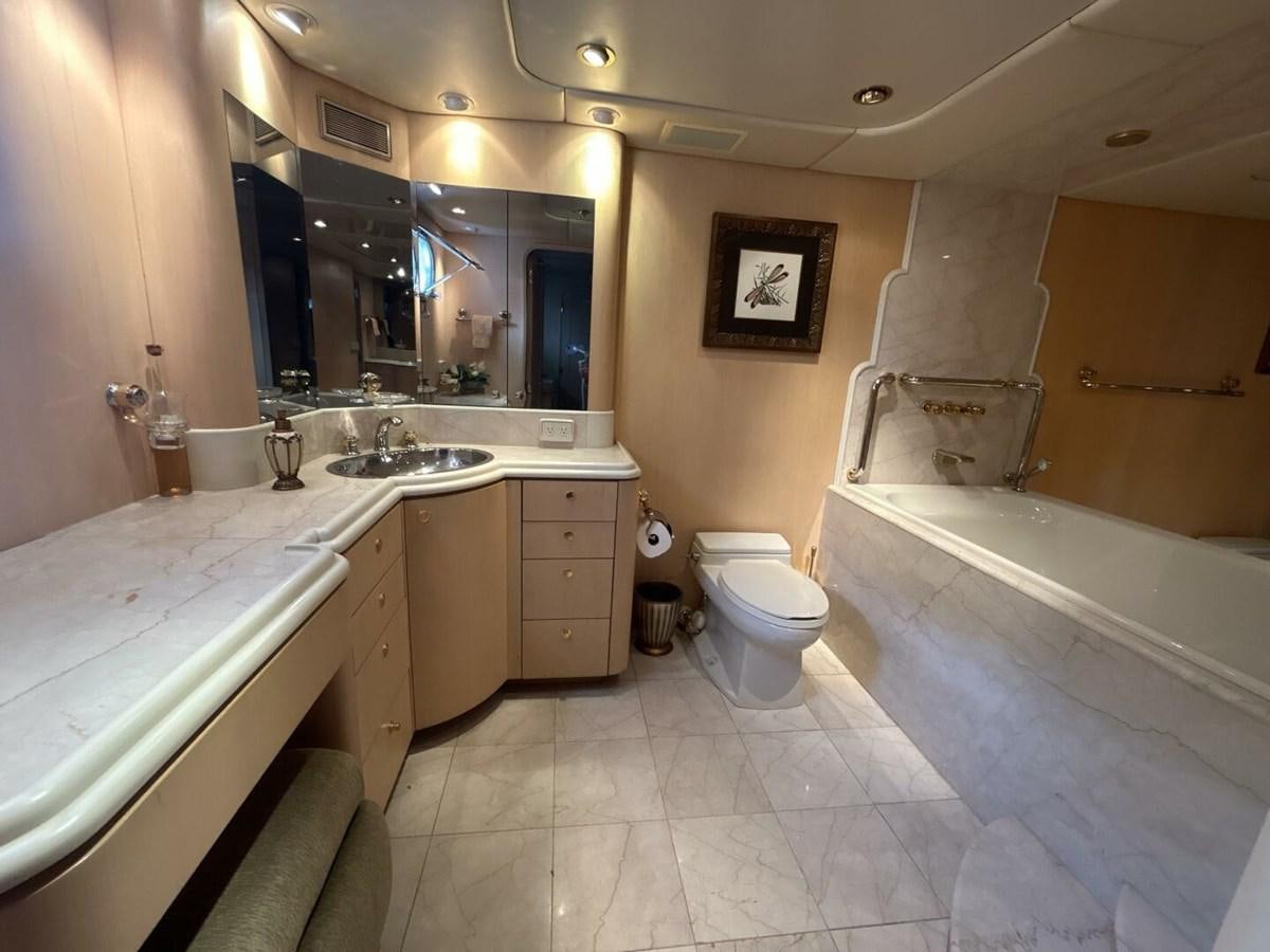 a bathroom with a tub sink and toilet aboard MARGAUX Yacht for Sale