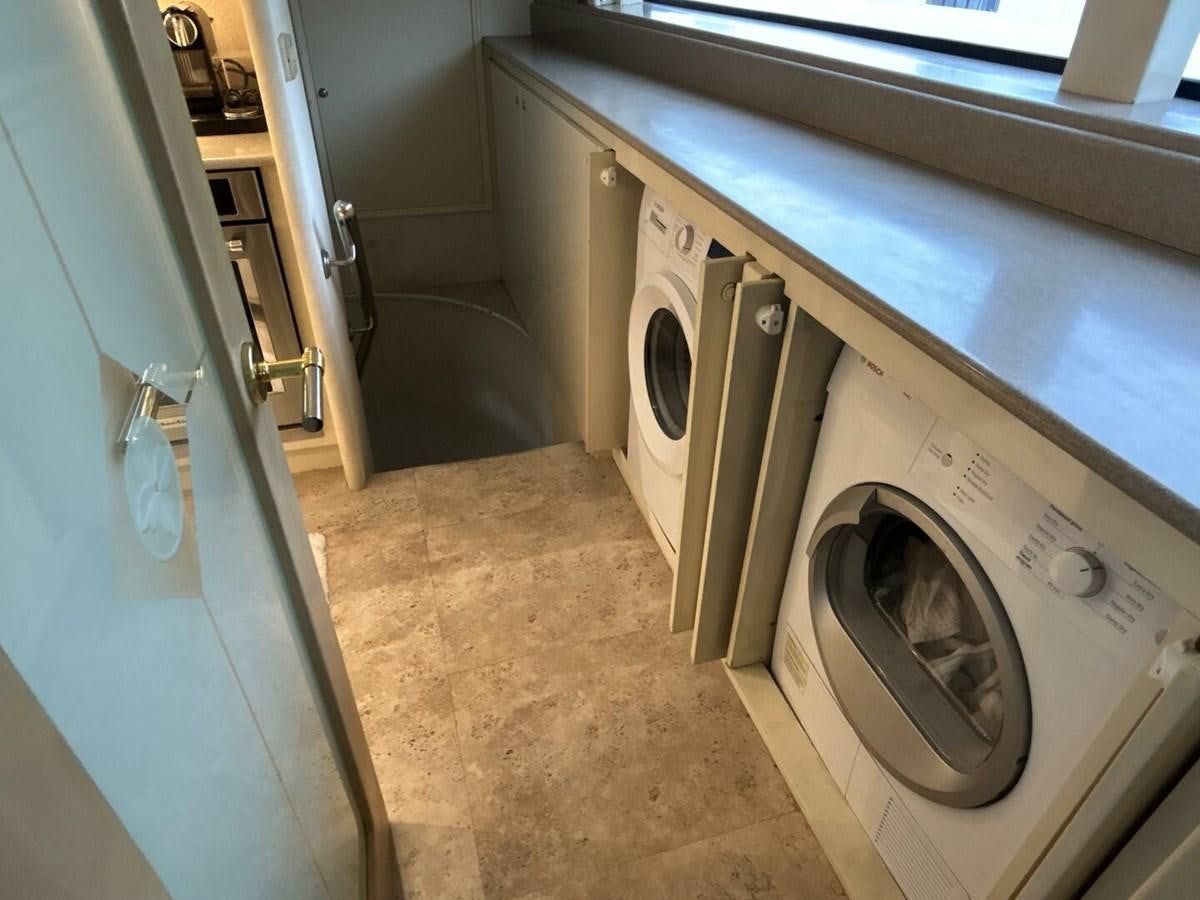a laundry room with a washing machine aboard MARGAUX Yacht for Sale