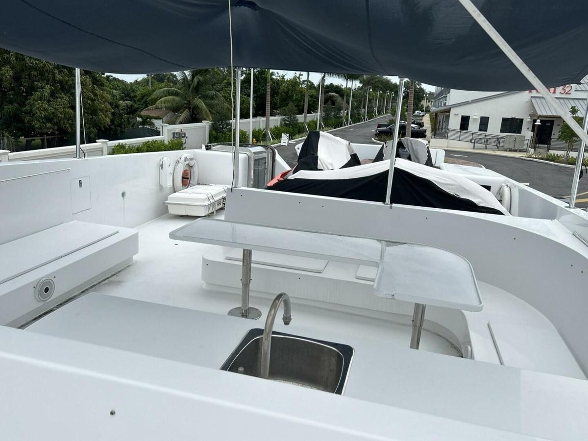 a white boat on a deck aboard MARGAUX Yacht for Sale