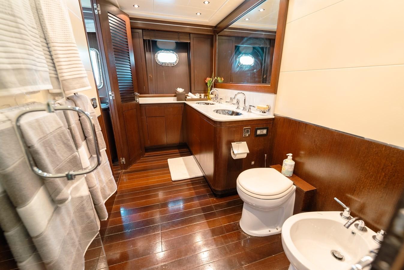 a bathroom with a sink toilet and a bathtub aboard SCRATCH Yacht for Sale