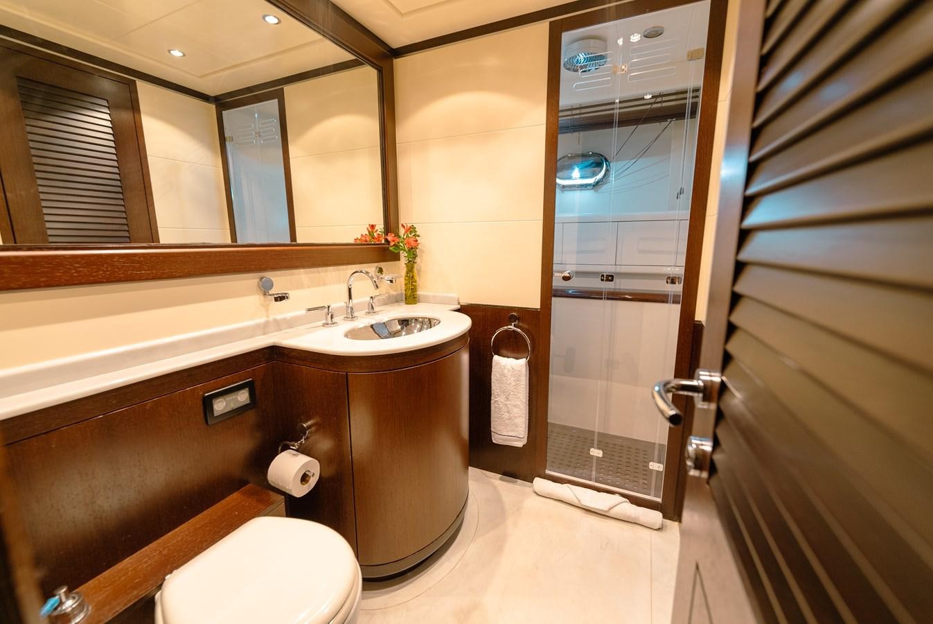 a bathroom with a sink and a toilet aboard SCRATCH Yacht for Sale