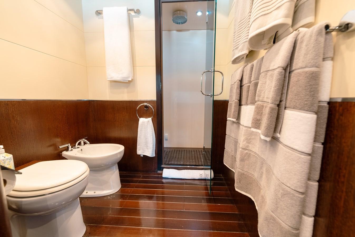 a bathroom with a standup shower aboard SCRATCH Yacht for Sale