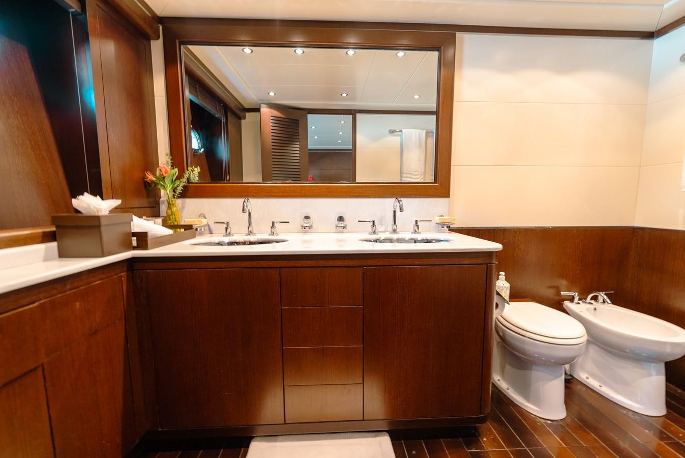 a bathroom with a large mirror aboard SCRATCH Yacht for Sale