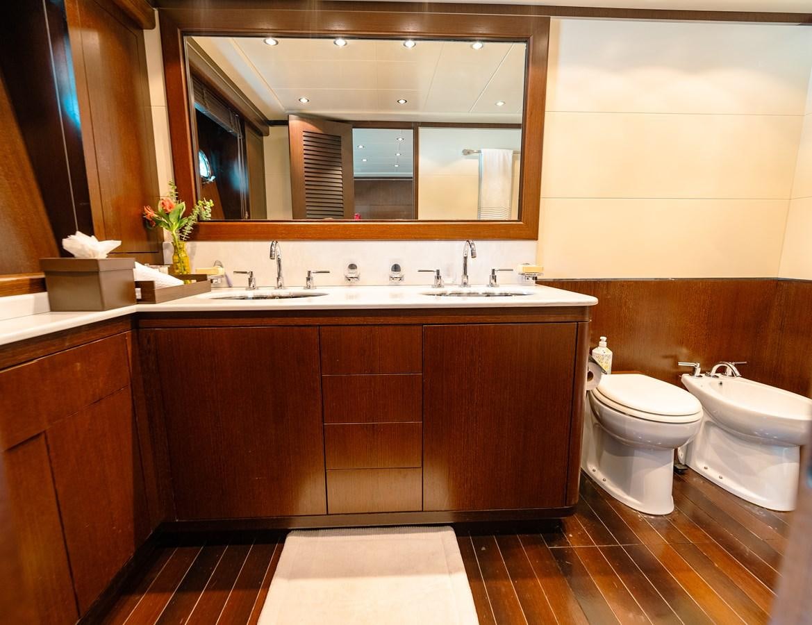 a bathroom with a sink and a toilet aboard SCRATCH Yacht for Sale