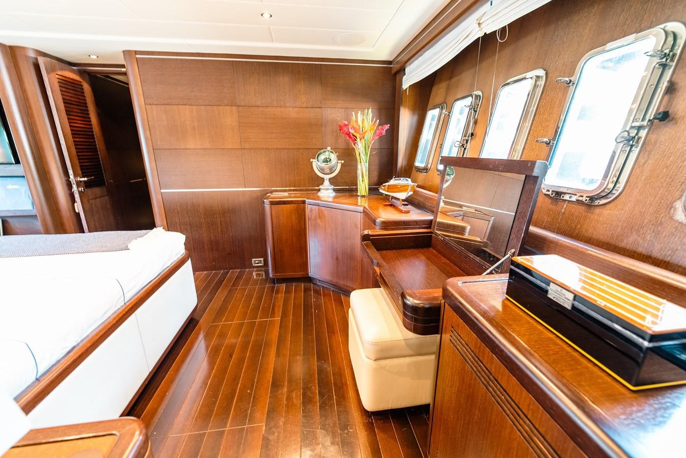 a room with a table chairs and a window aboard SCRATCH Yacht for Sale