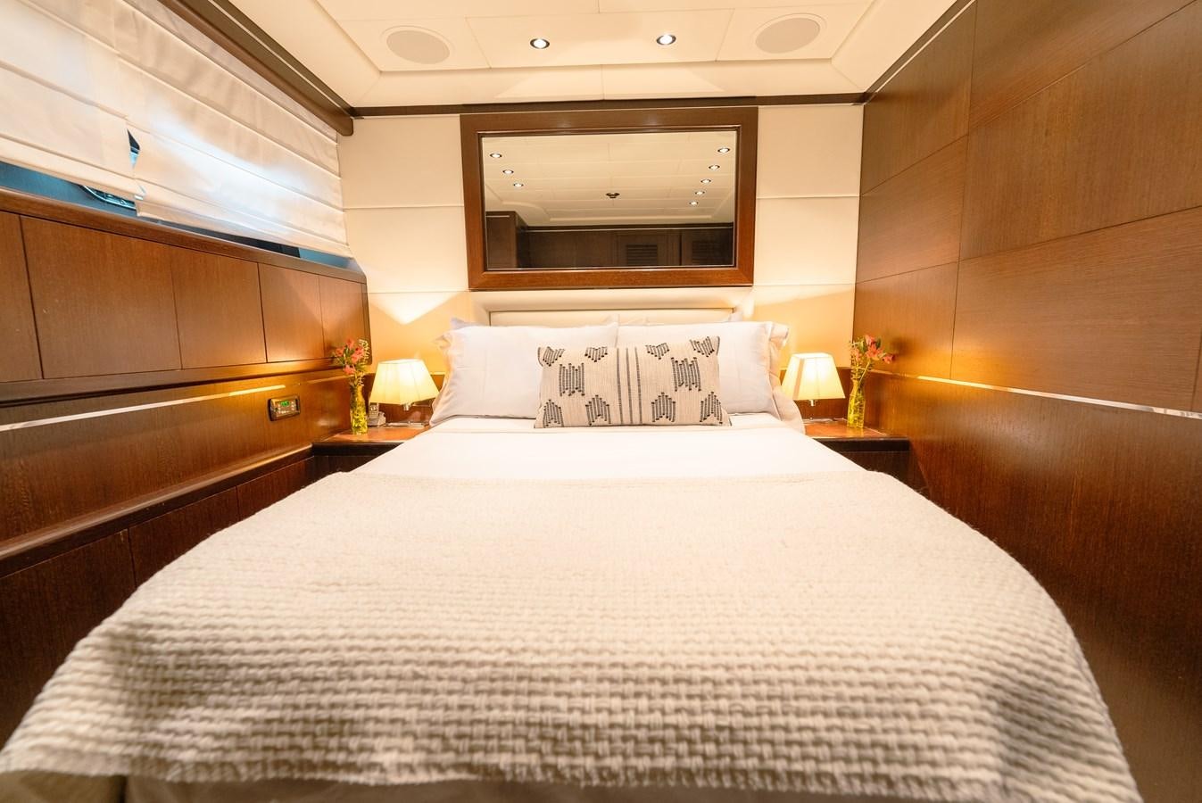 a bed with white sheets aboard SCRATCH Yacht for Sale
