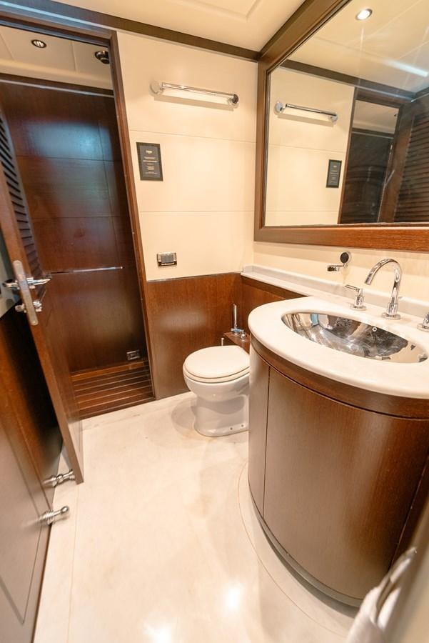 a bathroom with a sink toilet and a bathtub aboard SCRATCH Yacht for Sale