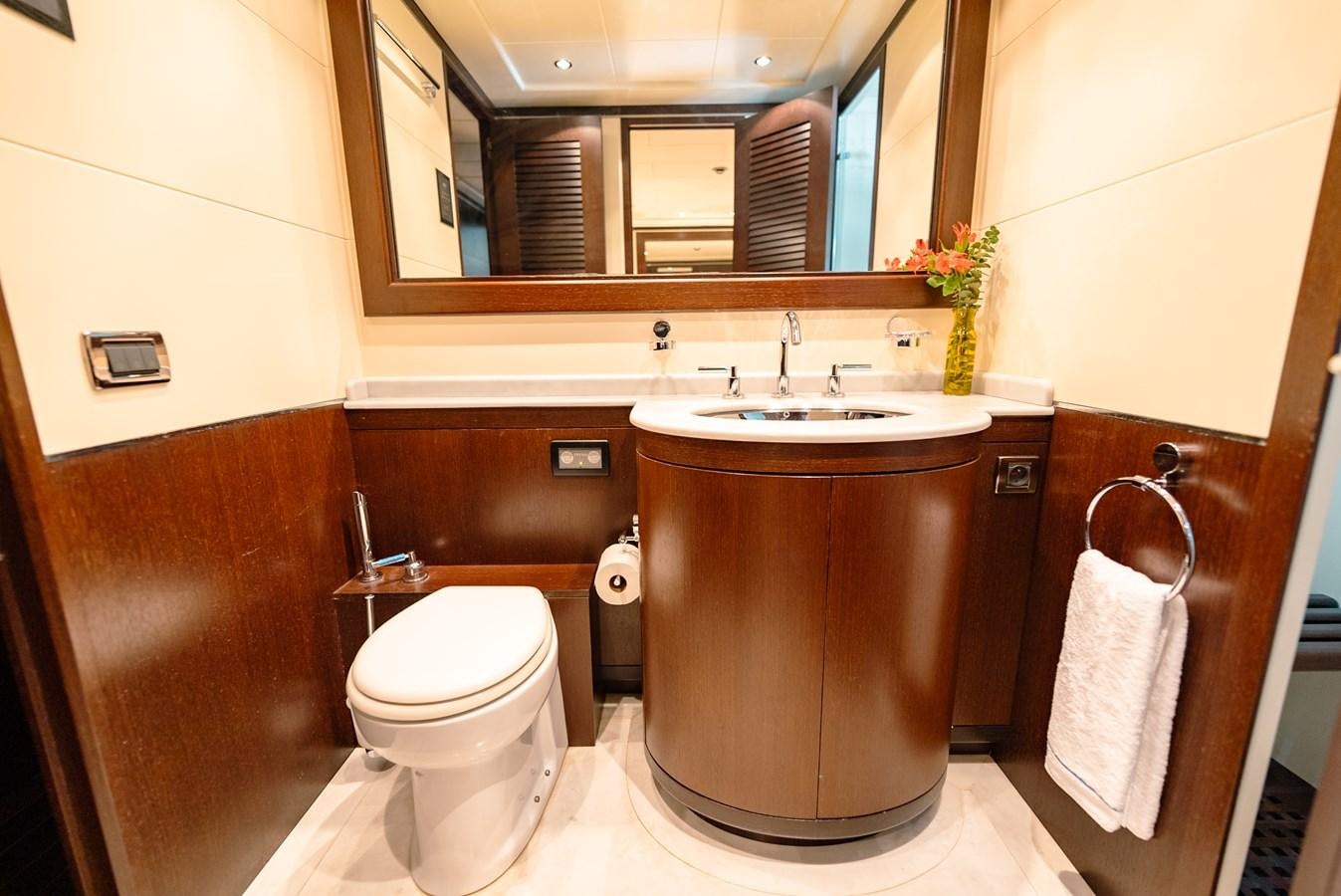 a bathroom with a toilet and a sink aboard SCRATCH Yacht for Sale