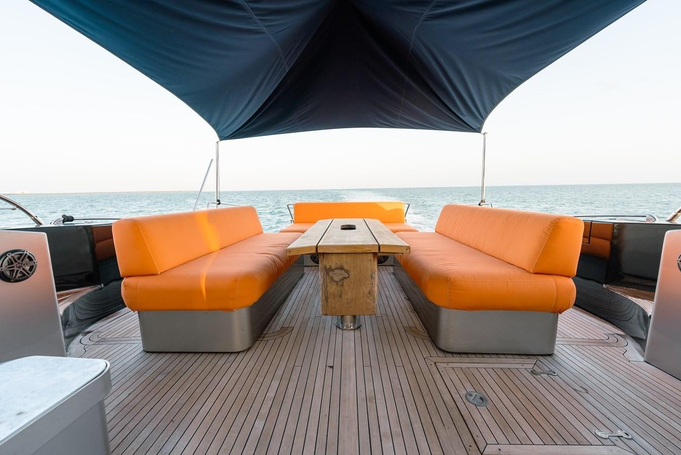 a lounge chair on a deck aboard SCRATCH Yacht for Sale