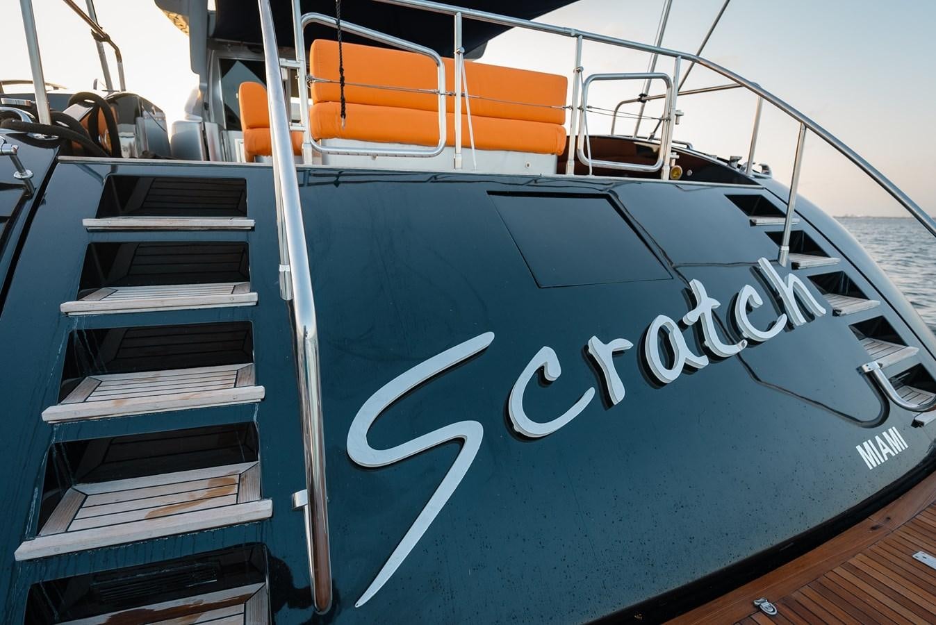 a boat with a sign on the front aboard SCRATCH Yacht for Sale