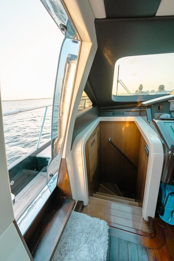 a hallway with a door and a window aboard SCRATCH Yacht for Sale