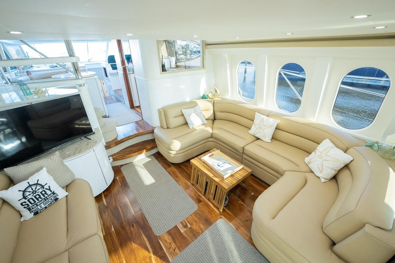 a living room with a couch and a television aboard 70 Yacht for Sale
