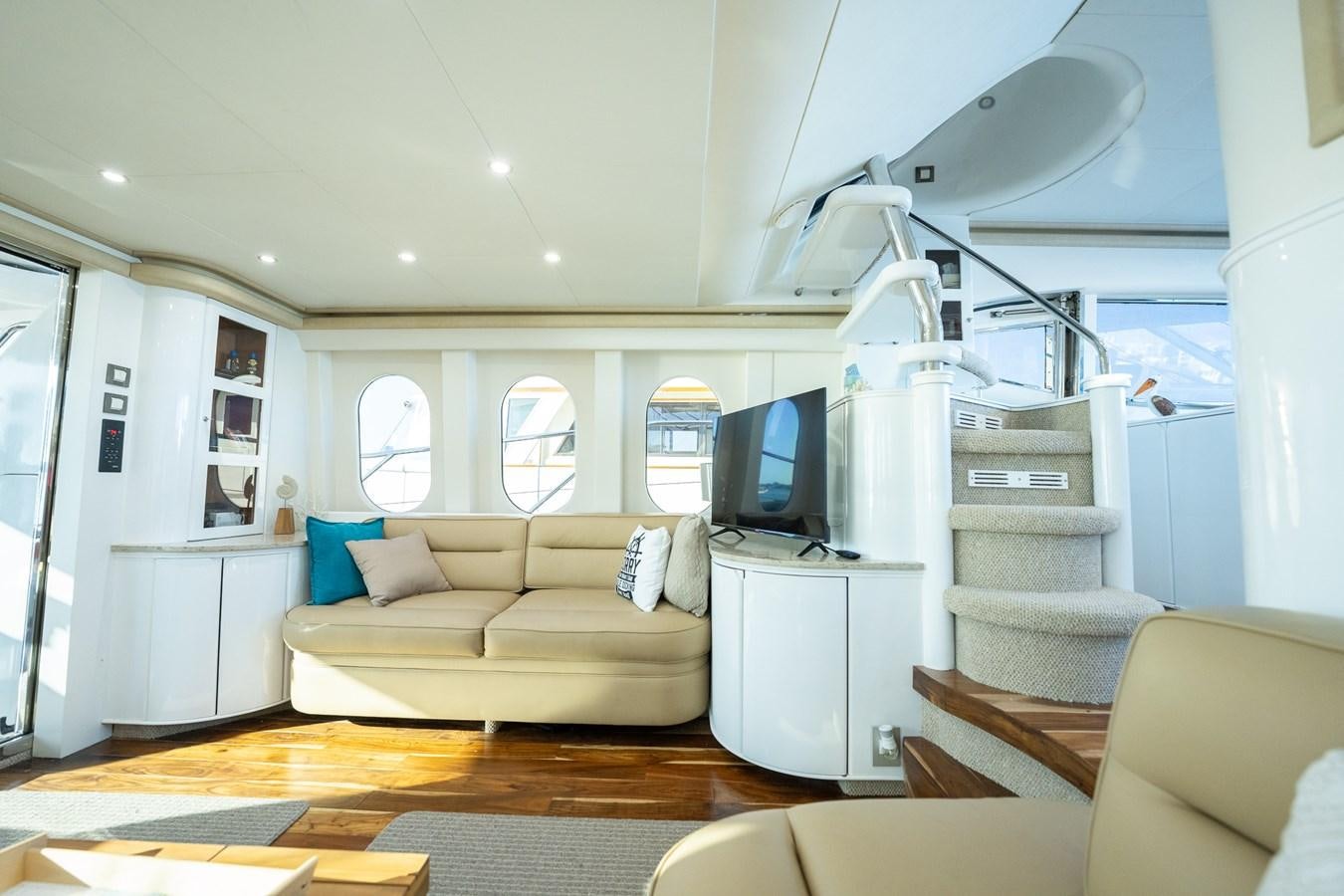 a living room with a large window aboard 70 Yacht for Sale