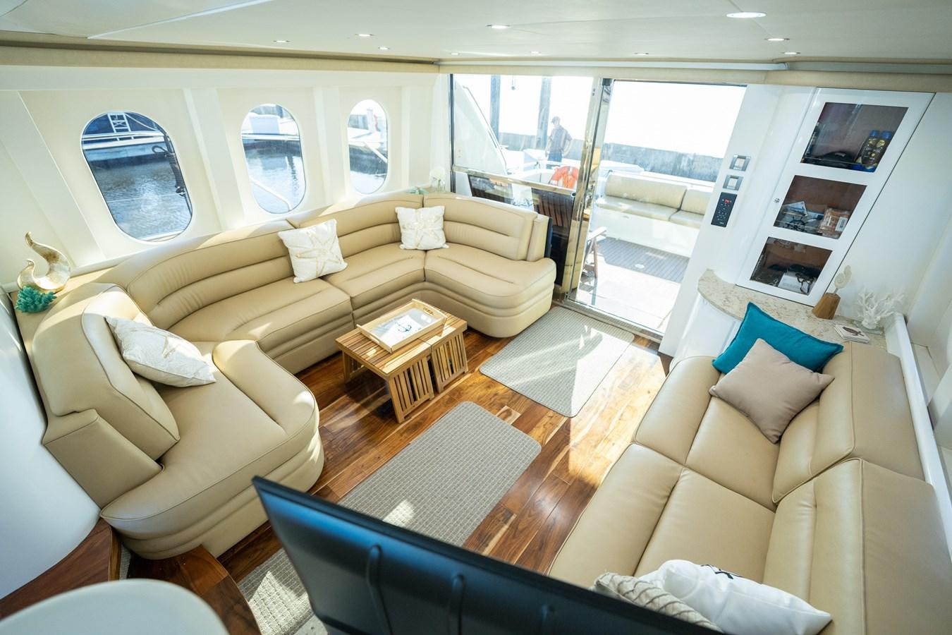a living room with a couch and a table aboard 70 Yacht for Sale
