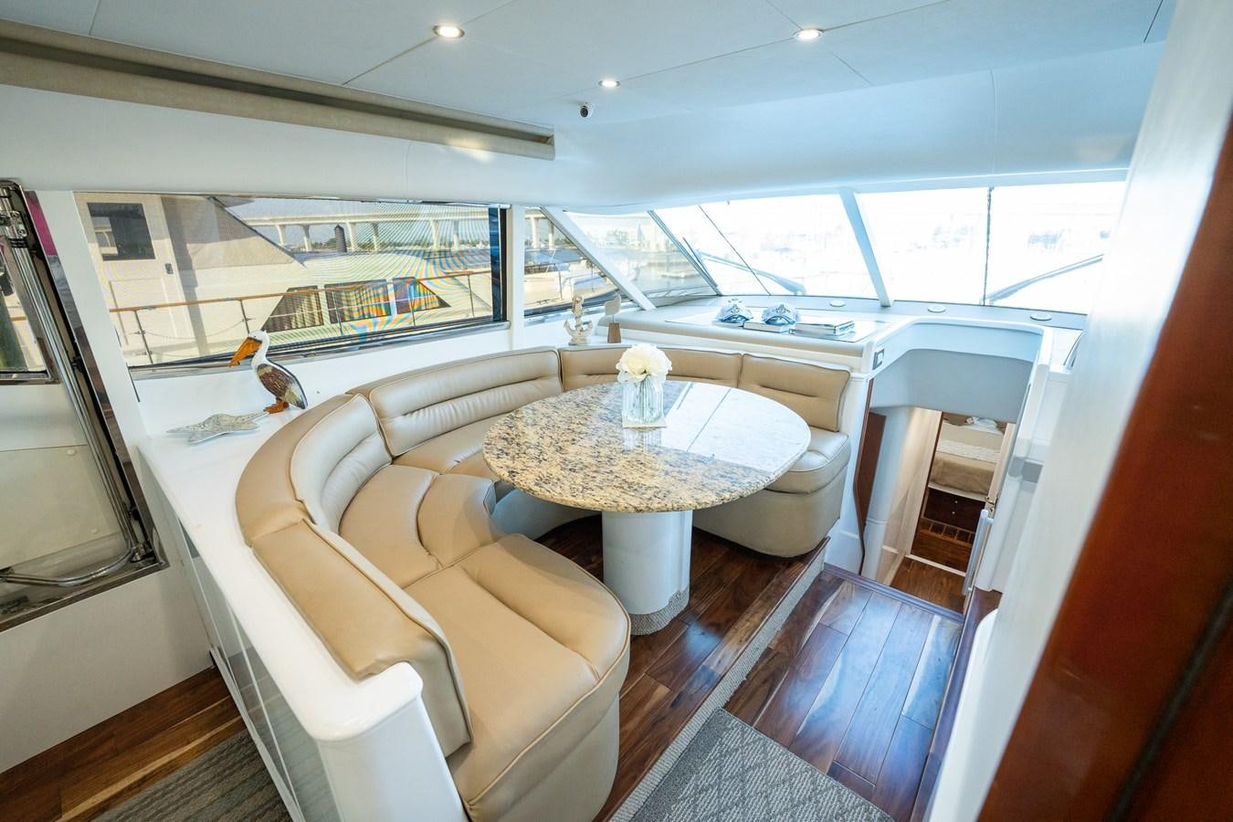 a living room with a large window aboard 70 Yacht for Sale