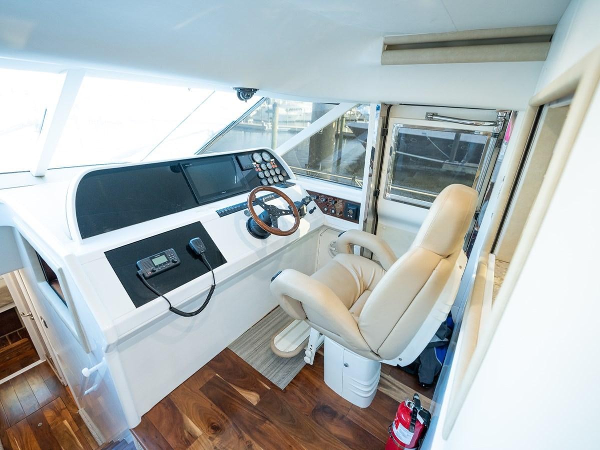 a car with a fan and a chair in it aboard 70 Yacht for Sale