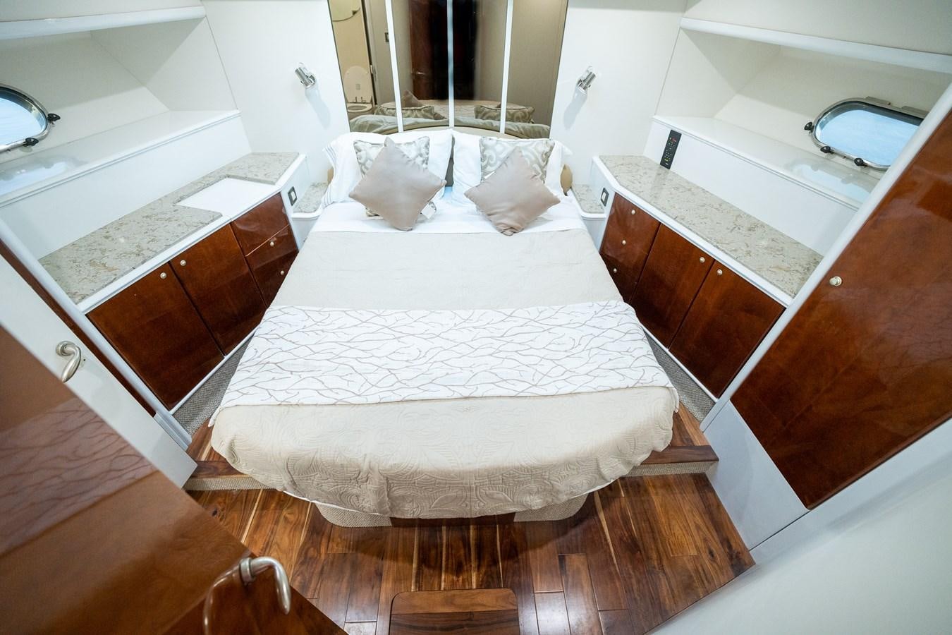 a large white bed sits in a bathroom aboard 70 Yacht for Sale