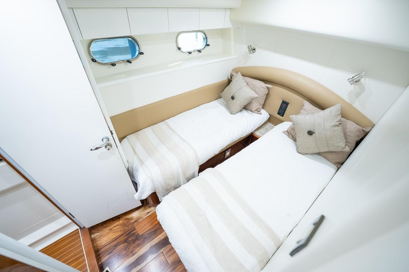 a couple of beds in a room aboard 70 Yacht for Sale