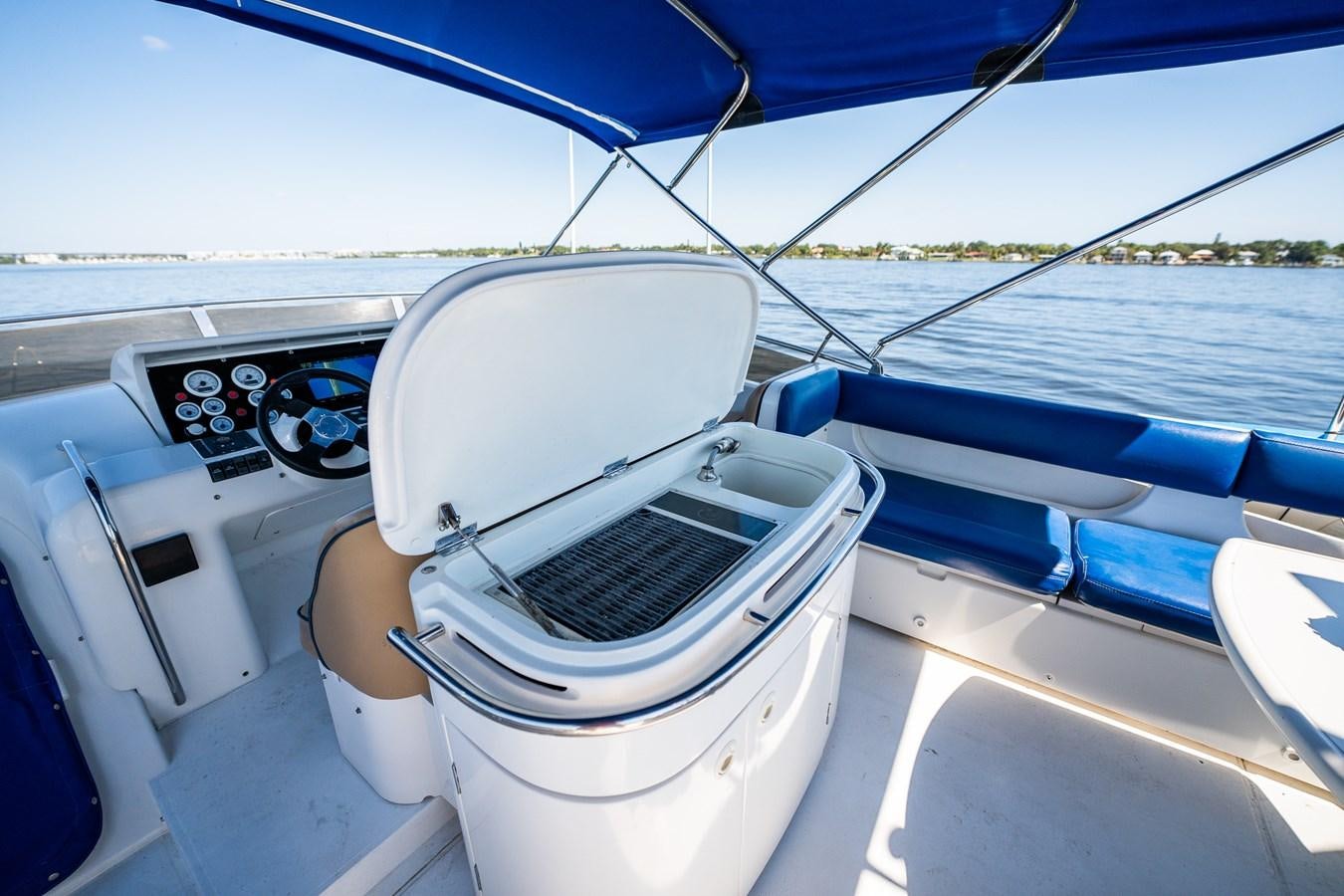a boat with a seat on the front aboard 70 Yacht for Sale