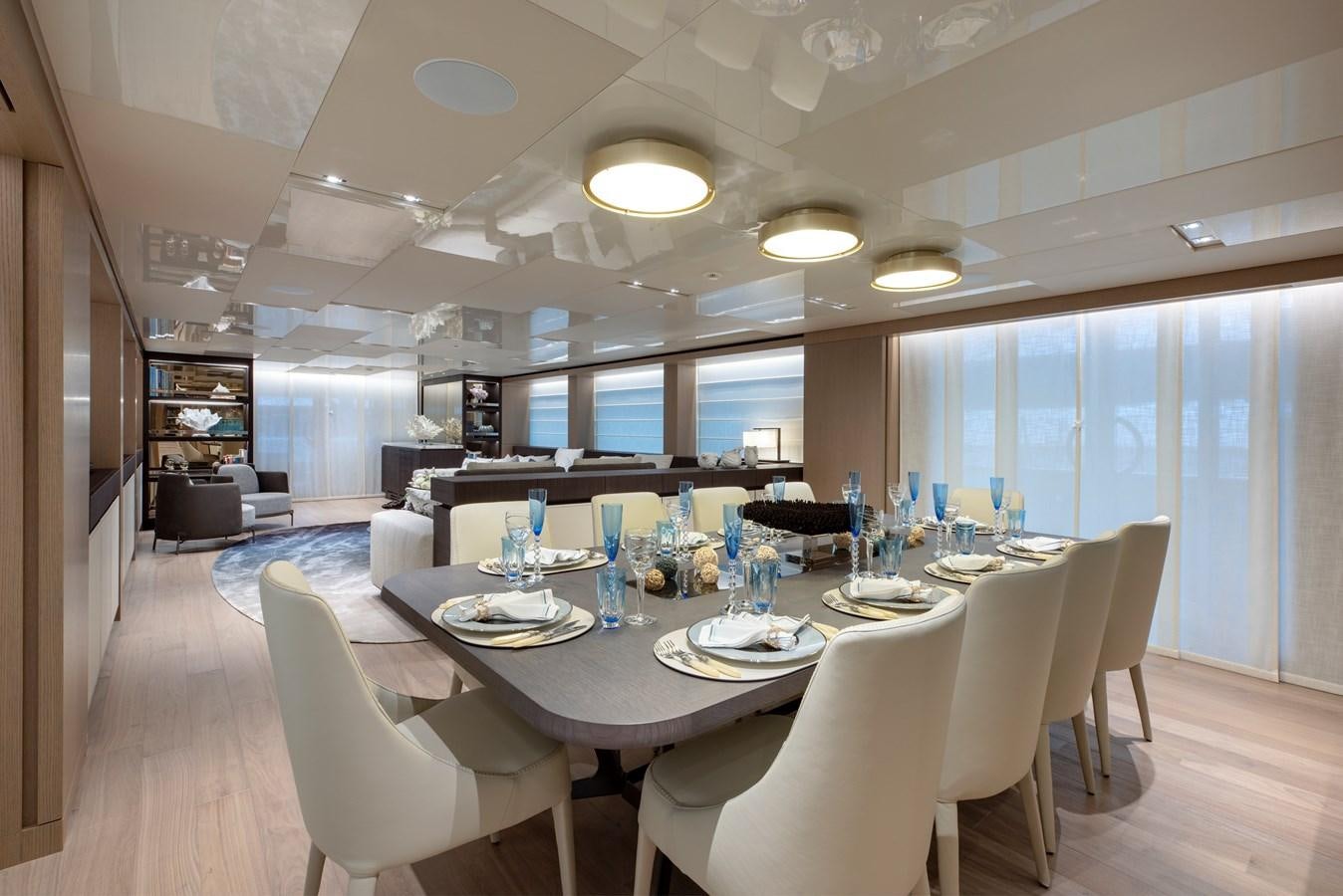 a large dining room with a large table and chairs aboard INSIEME Yacht for Sale