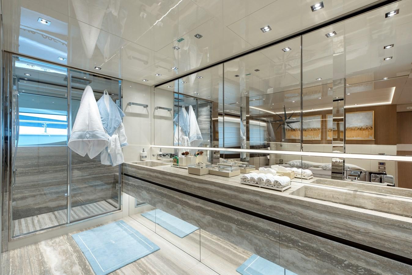 a large bathroom with glass walls aboard INSIEME Yacht for Sale